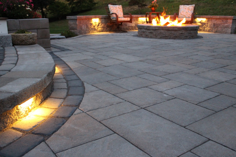 Small transitional backyard patio in Boston with a fire feature, concrete pavers and no cover.