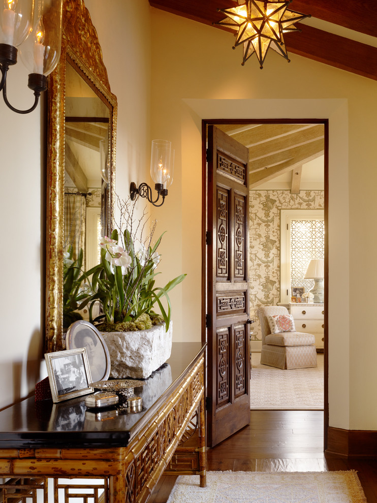 Hallway - traditional dark wood floor hallway idea in San Francisco with beige walls
