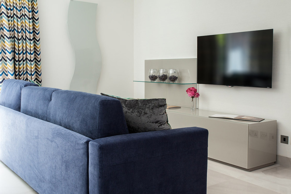 Photo of a medium sized contemporary formal open plan living room in London with multi-coloured walls, marble flooring and a wall mounted tv.