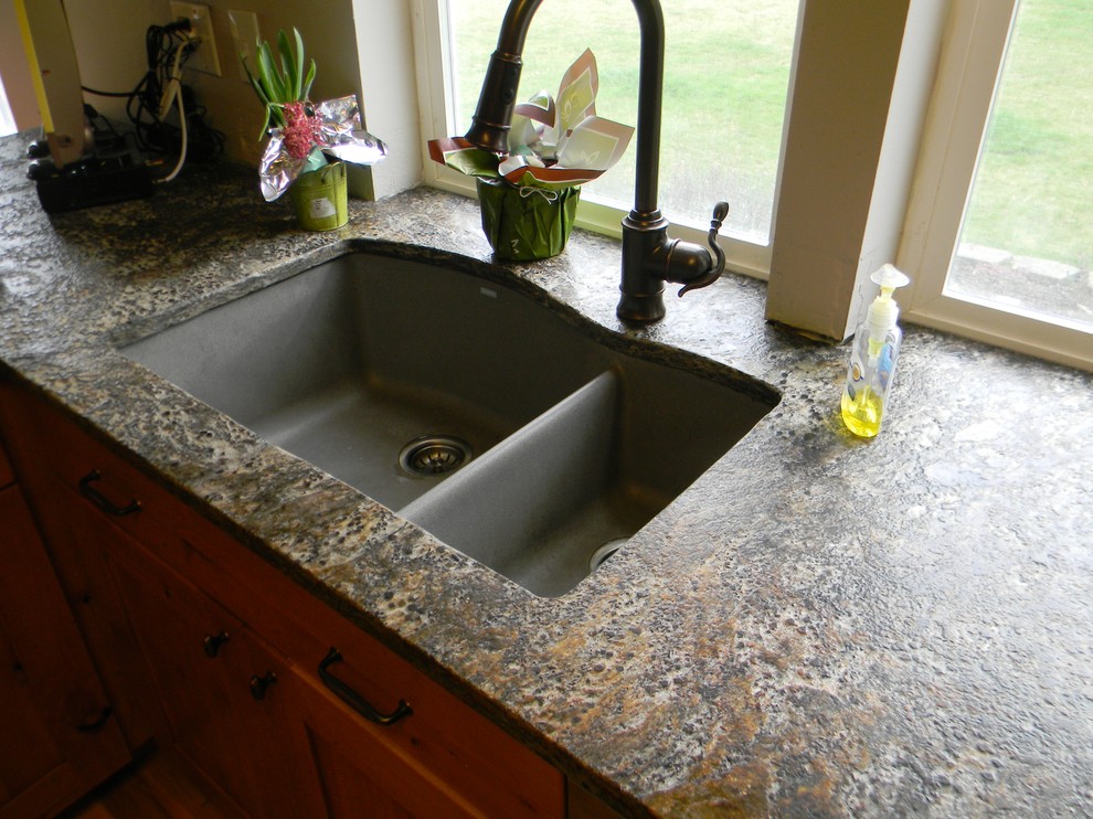 Kitchen photo in Seattle with an undermount sink and granite countertops