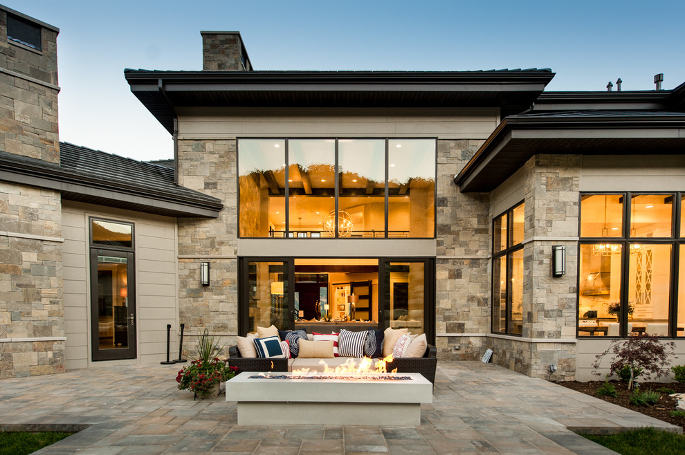 Inspiration for a mid-sized transitional two-storey brown exterior in Salt Lake City with stone veneer.