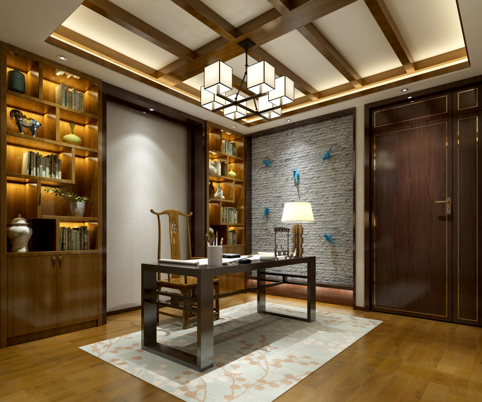 Inspiration for a large contemporary study room in Raleigh with grey walls, medium hardwood floors, a freestanding desk, beige floor, coffered and brick walls.