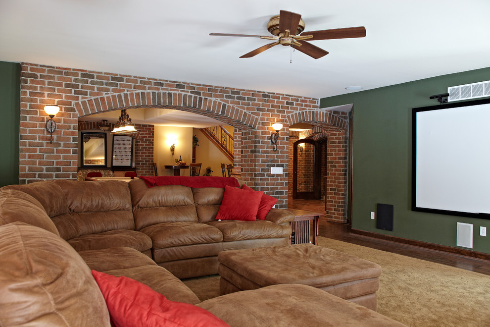 Photo of a traditional home theatre in Detroit with green walls.