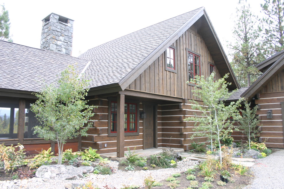 Inspiration for a rustic single front door remodel in Boise with a dark wood front door