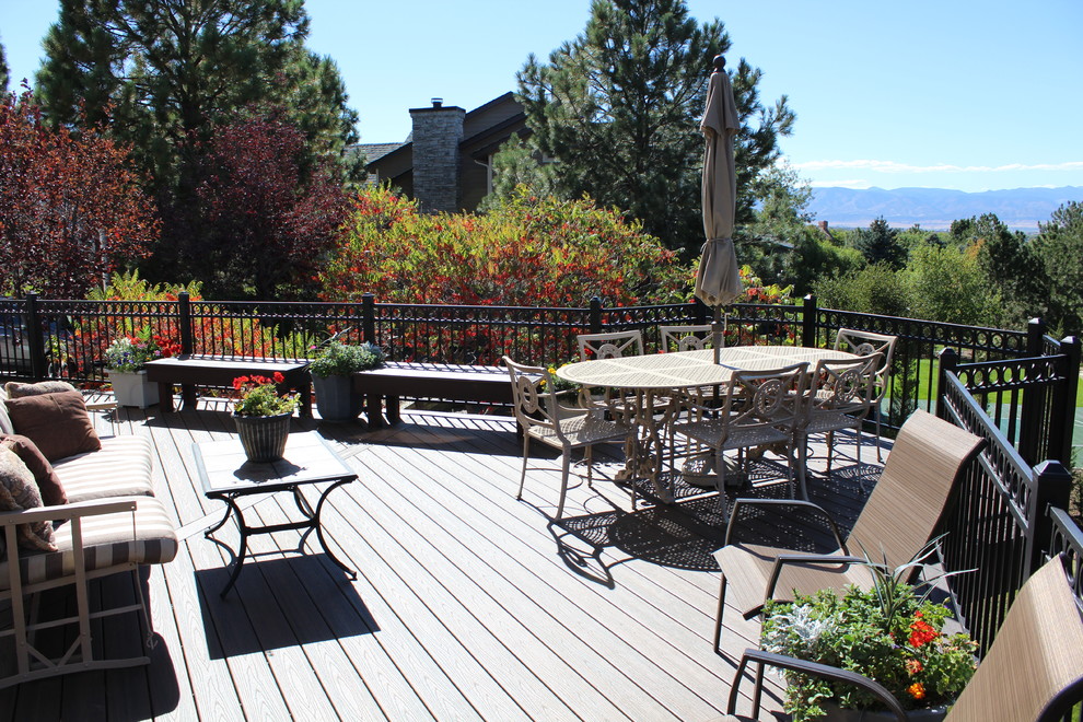 Example of a large transitional backyard outdoor kitchen deck design in Denver with no cover