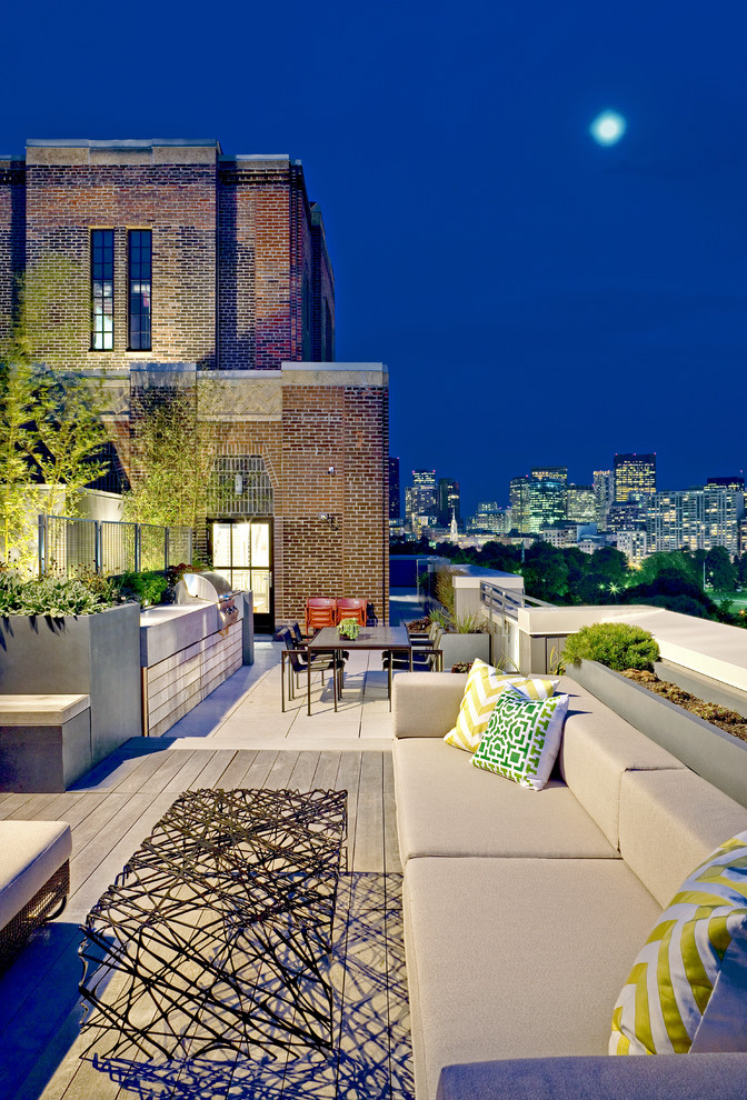 This is an example of a large contemporary rooftop and rooftop deck in Boston with an outdoor kitchen and no cover.