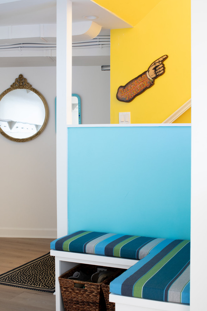 Inspiration for a mid-sized eclectic underground vinyl floor and brown floor basement remodel with white walls