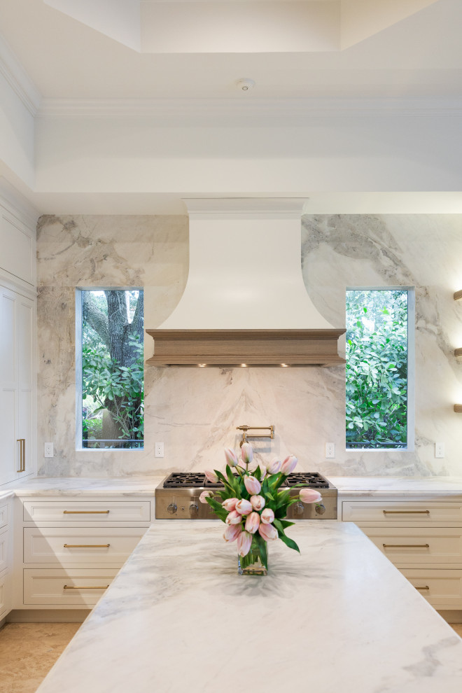 Inspiration for a transitional u-shaped kitchen remodel with an island