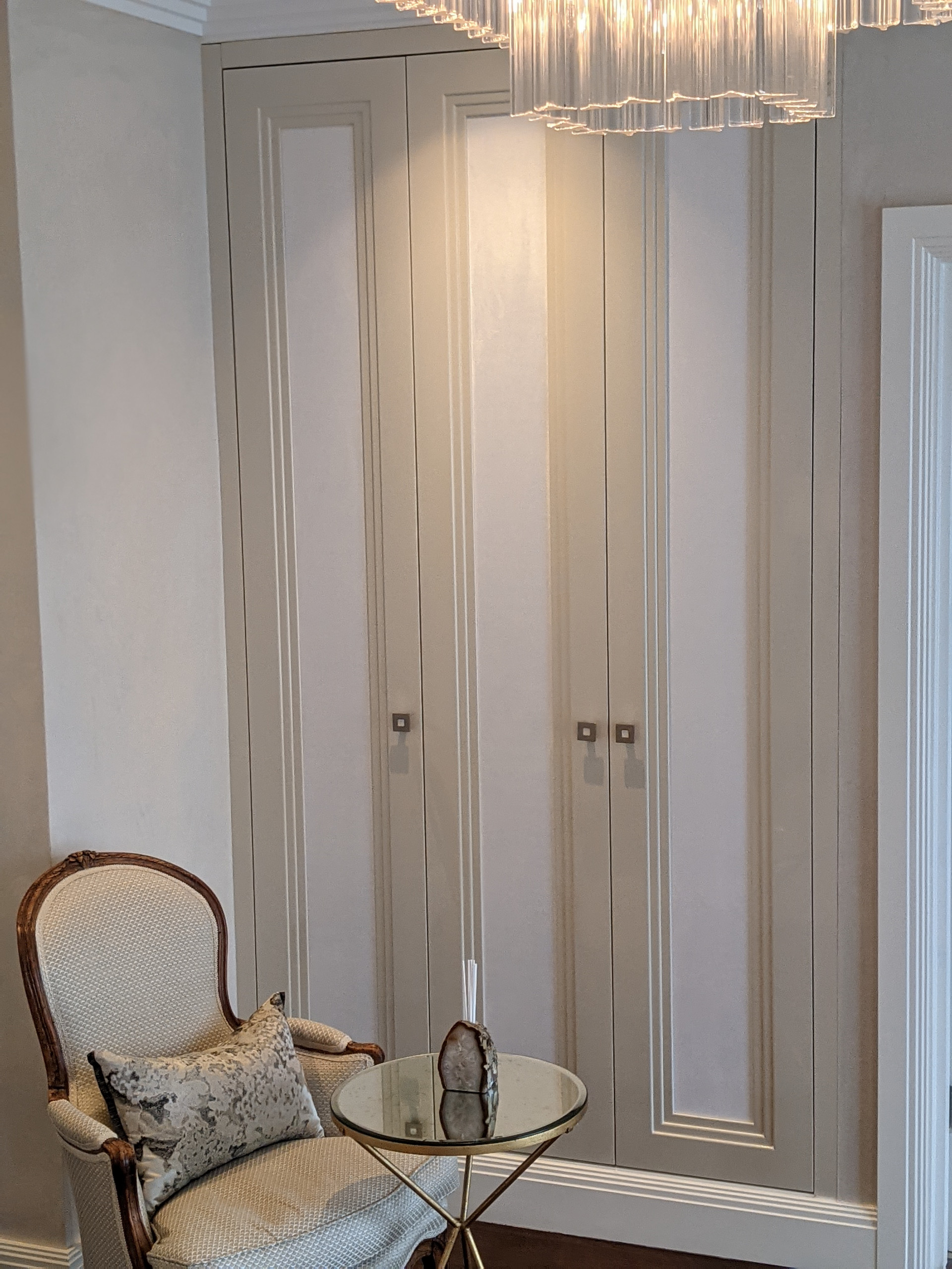 Fitted Triple Step Design wardrobes upholstered in suedette panels