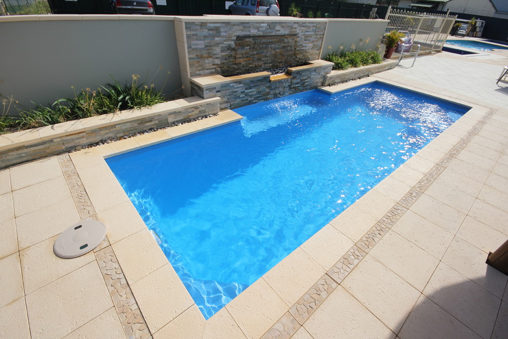 Small contemporary courtyard pool in Perth.