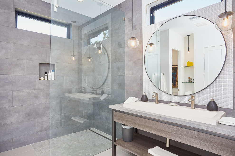 Design ideas for a large contemporary bathroom in Dallas with flat-panel cabinets, beige cabinets, an open shower, a one-piece toilet, white tile, porcelain tile, white walls, porcelain floors, a trough sink, concrete benchtops, beige floor, an open shower and grey benchtops.