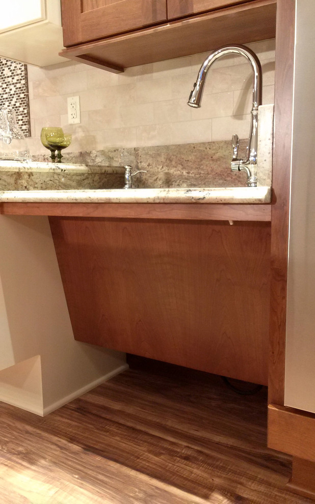Inspiration for a large transitional l-shaped medium tone wood floor open concept kitchen remodel with an undermount sink, shaker cabinets, medium tone wood cabinets, granite countertops, beige backsplash, ceramic backsplash, white appliances and an island