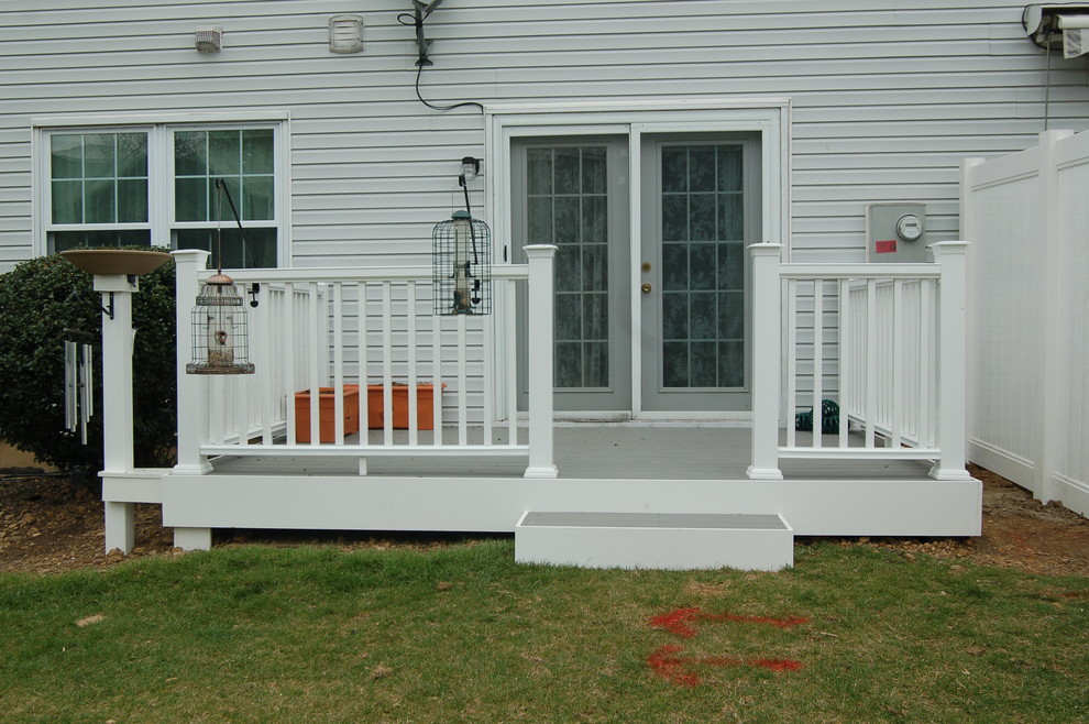Photo of a mid-sized traditional backyard deck in Other with no cover.