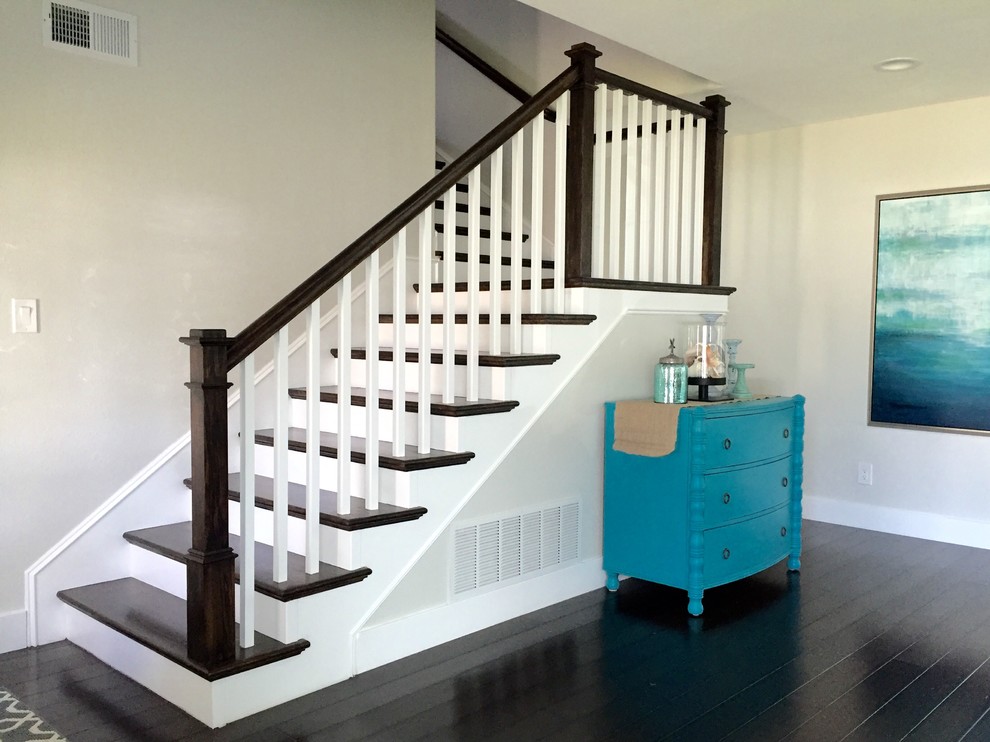 Design ideas for a mid-sized arts and crafts wood l-shaped staircase in Los Angeles with painted wood risers.