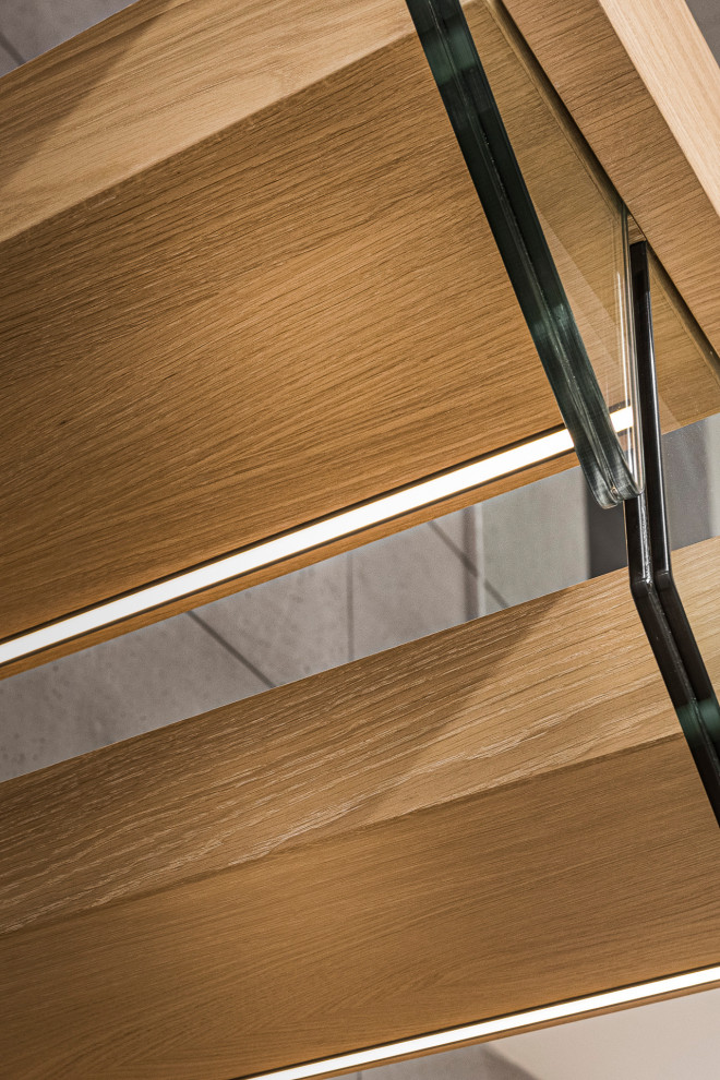 Modelo de escalera recta actual de tamaño medio con escalones de madera pintada y barandilla de vidrio