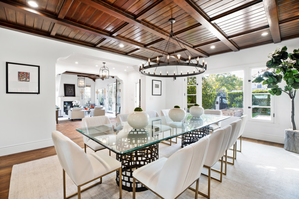 Mediterranean separate dining room in Los Angeles with white walls, medium hardwood floors, no fireplace, coffered and wood.