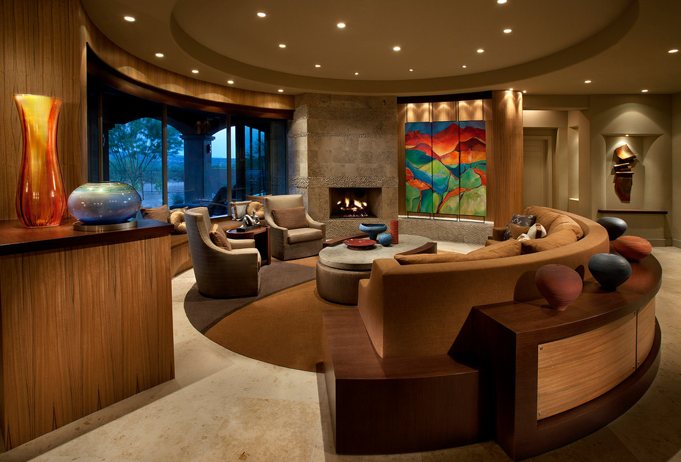 Design ideas for a large contemporary open concept living room in Phoenix with a standard fireplace, beige walls and a concealed tv.