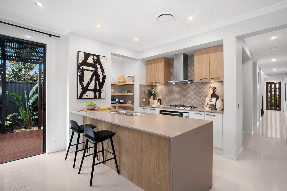 Inspiration for a contemporary galley kitchen in Sydney with a double-bowl sink, flat-panel cabinets, medium wood cabinets, brown splashback, stainless steel appliances, a peninsula, white floor and brown benchtop.