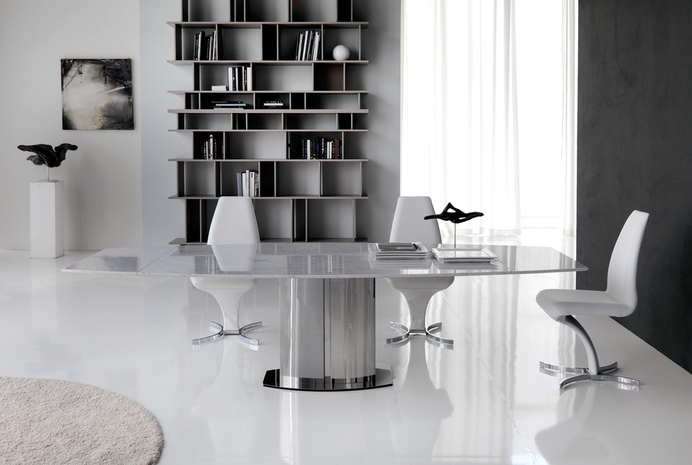 Photo of a modern dining room in Miami with black walls and porcelain floors.