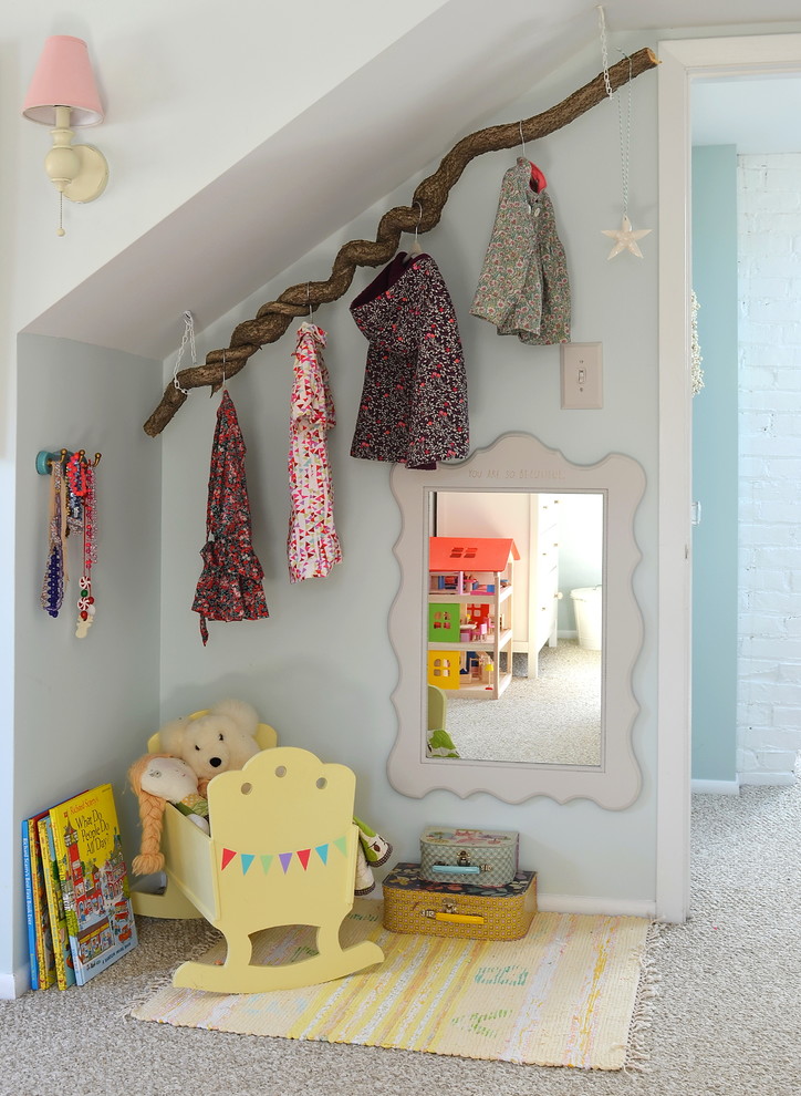 Inspiration for a contemporary kids' room for girls in New York with blue walls and carpet.