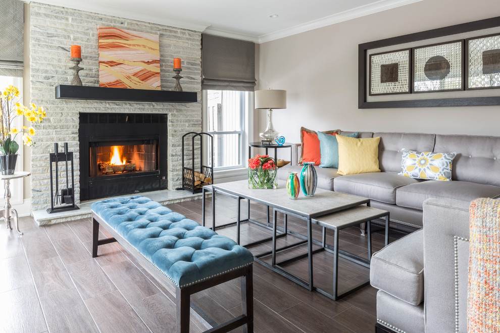 Example of a transitional formal dark wood floor living room design in New York with beige walls, a standard fireplace and a tile fireplace