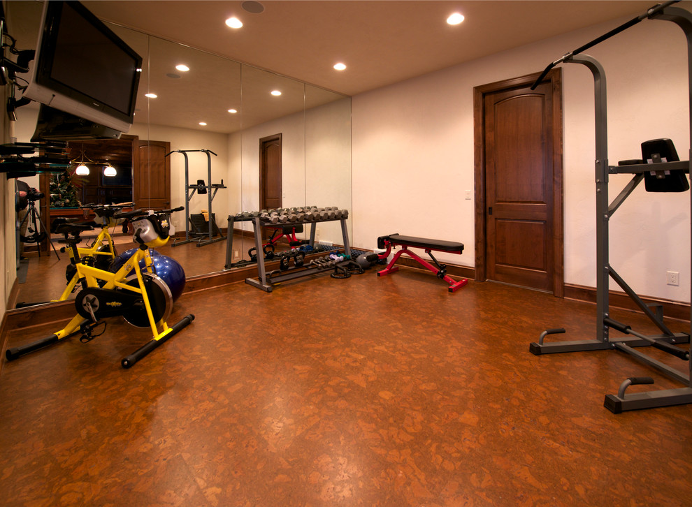 Inspiration for a mid-sized contemporary multipurpose gym in Other with white walls and cork floors.