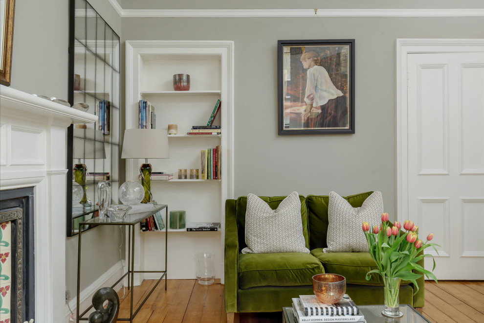 Living room - traditional light wood floor living room idea in Edinburgh with a standard fireplace and no tv