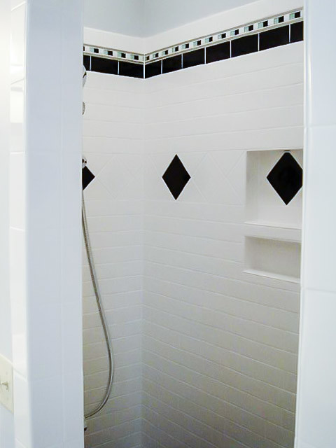 Inspiration for a large contemporary master bathroom in Other with black cabinets, an alcove shower, black and white tile, ceramic tile, grey walls and marble benchtops.