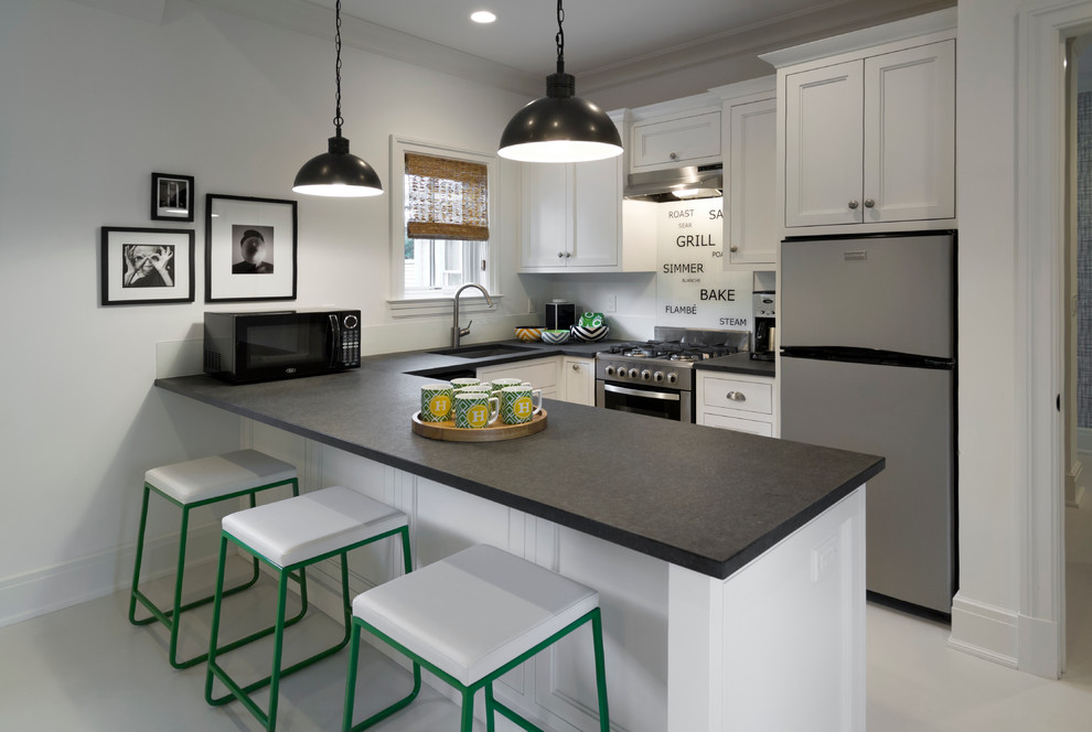 Inspiration for a small transitional u-shaped eat-in kitchen in New York with an undermount sink, recessed-panel cabinets, stainless steel appliances, a peninsula, granite benchtops, white splashback, glass sheet splashback and painted wood floors.