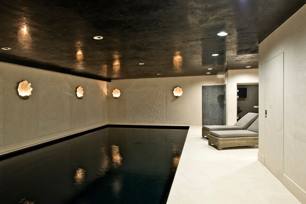 This is an example of a large contemporary indoor rectangular pool in Gloucestershire.