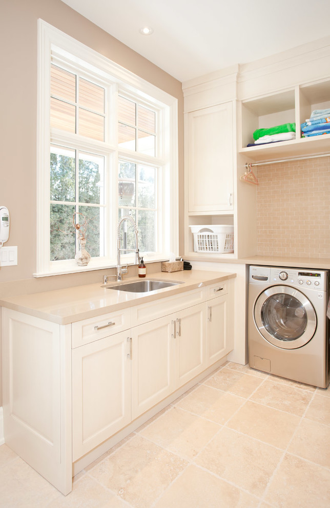 Photo of a transitional laundry room in Toronto.