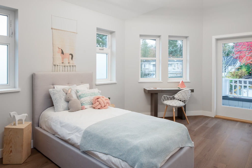 Design ideas for a contemporary kids' bedroom for girls in Vancouver with grey walls, dark hardwood floors and brown floor.