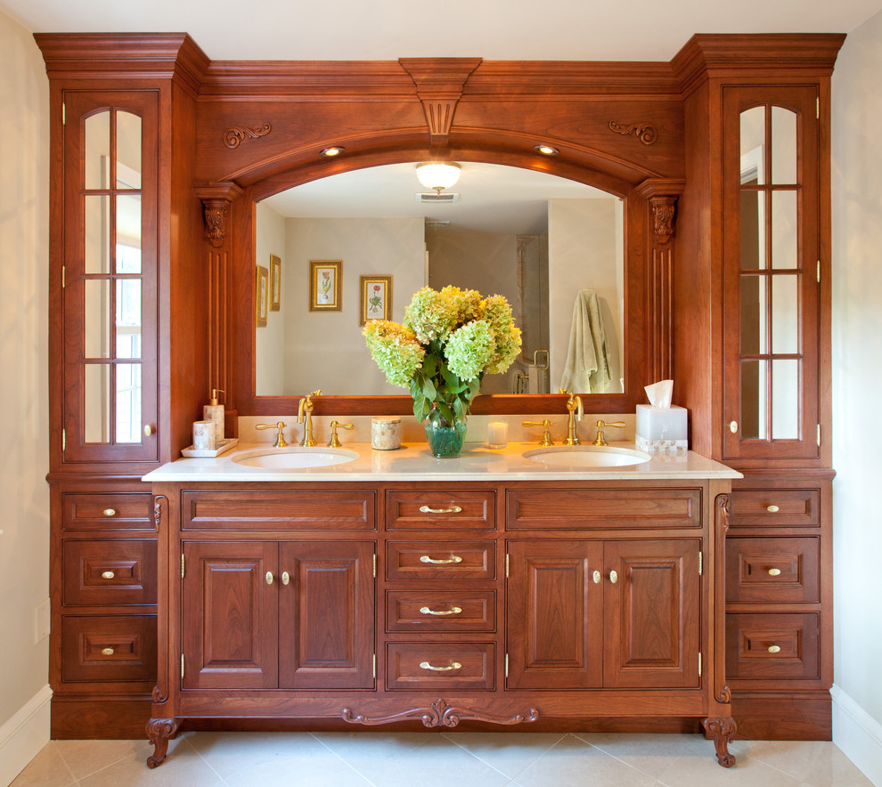 Design ideas for a traditional bathroom in Other with dark wood cabinets, beige walls and beaded inset cabinets.