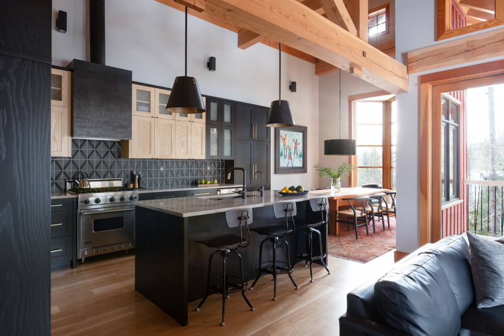 Inspiration for a large transitional l-shaped light wood floor, brown floor and exposed beam eat-in kitchen remodel with a double-bowl sink, shaker cabinets, black cabinets, quartzite countertops, black backsplash, ceramic backsplash, stainless steel appliances, an island and gray countertops