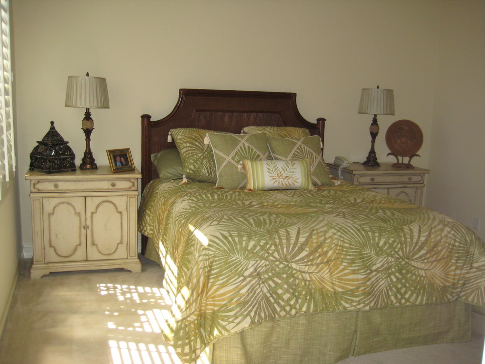 Photo of a mid-sized tropical guest bedroom in Other with carpet.