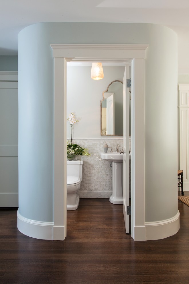 Small traditional powder room in Boston with a pedestal sink, a two-piece toilet, white tile, mosaic tile, white walls and dark hardwood floors.