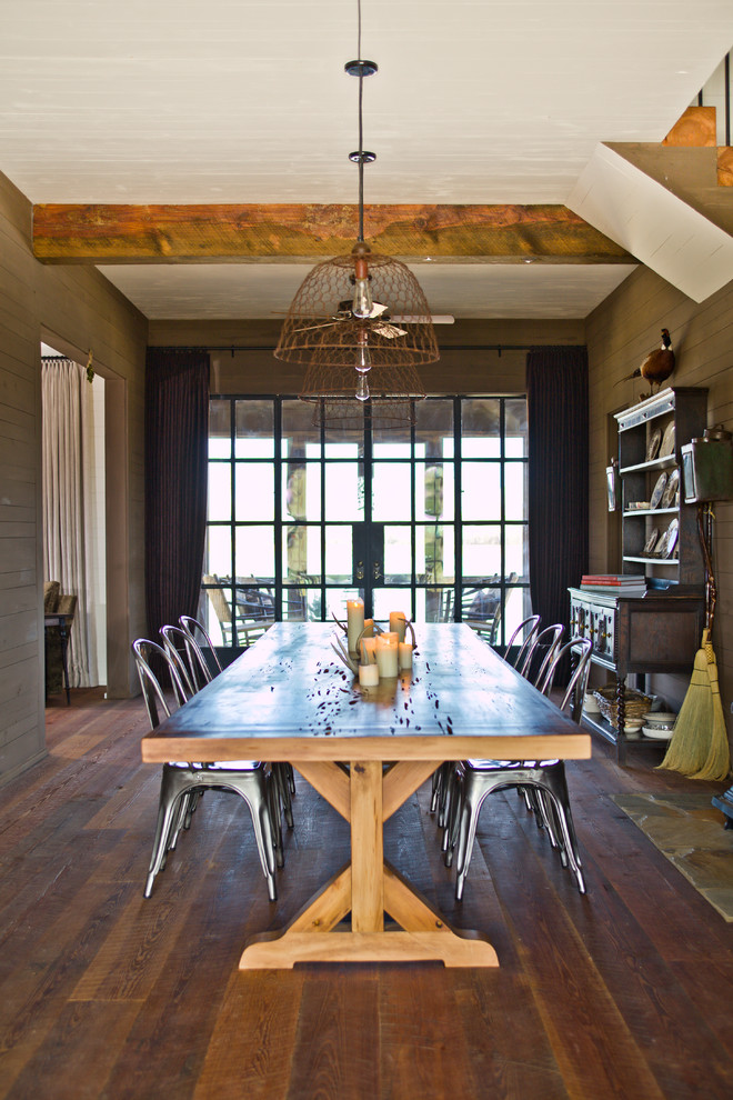 Design ideas for a country dining room in Atlanta with dark hardwood floors and brown walls.