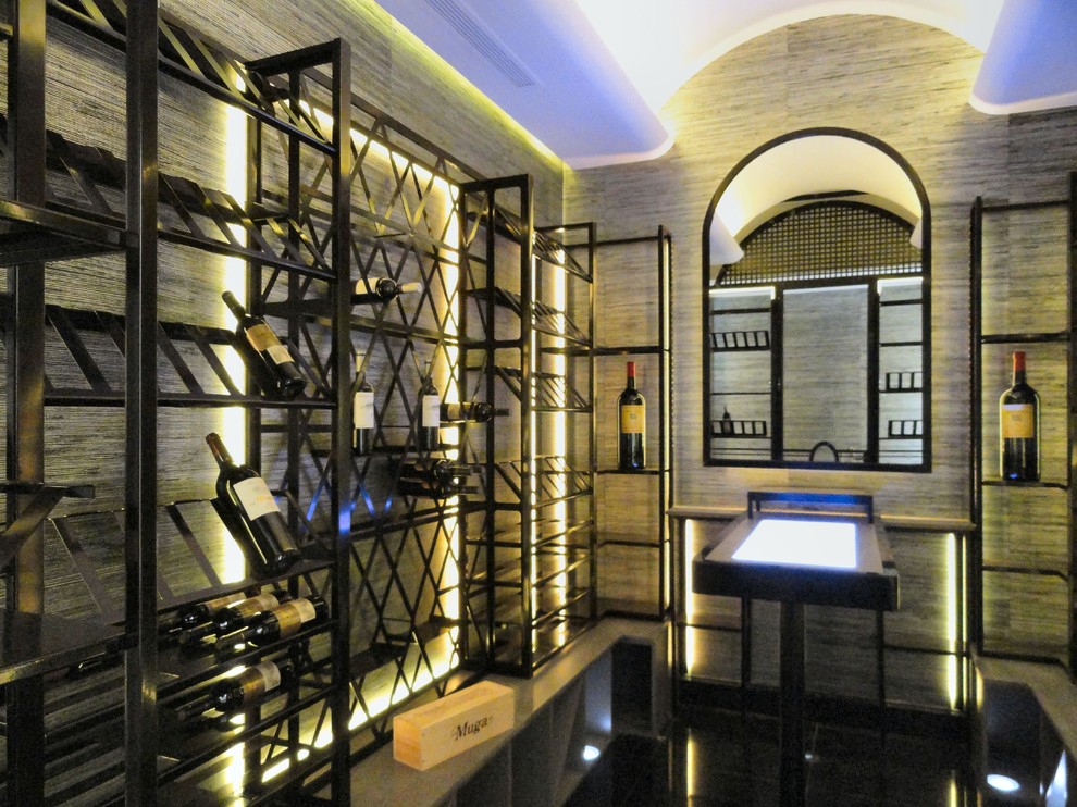 Inspiration for a mid-sized contemporary wine cellar remodel in Madrid with diamond bins