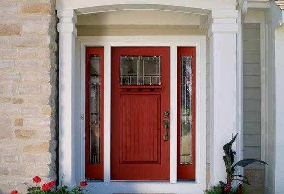 Example of a mid-sized transitional front door design with beige walls and a red front door