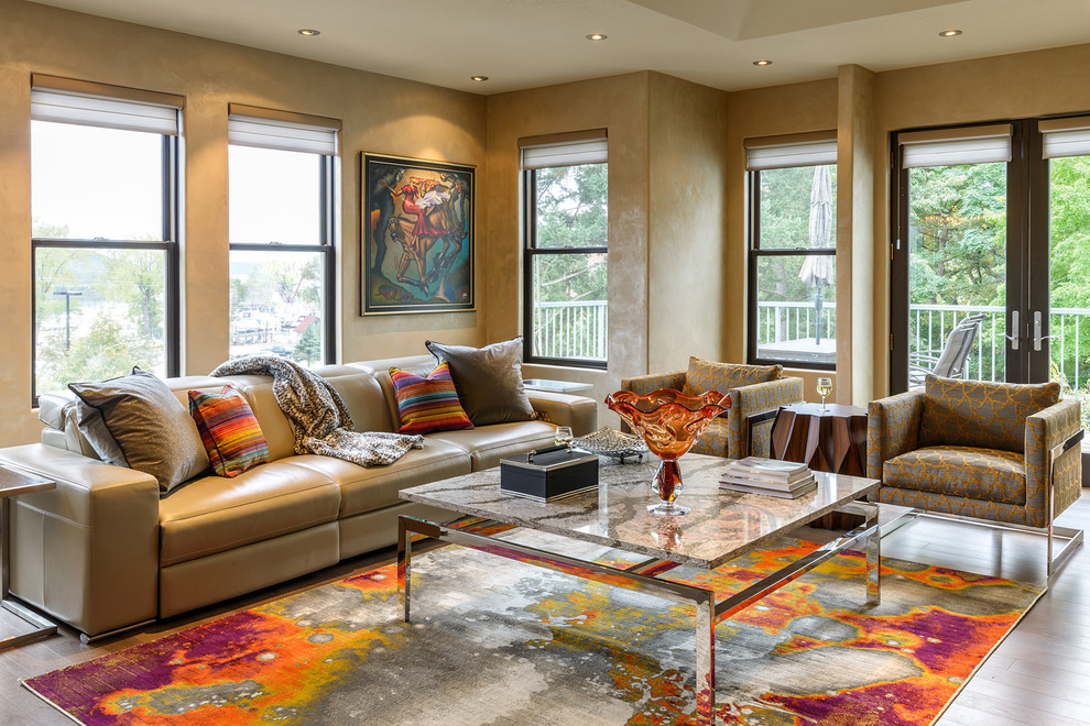 Contemporary living room in Minneapolis with brown walls, medium hardwood floors and brown floor.