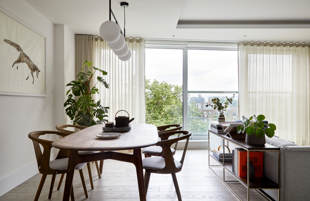 Inspiration for a mid-sized scandinavian dining room remodel in London