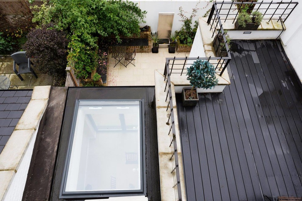 Design ideas for a contemporary backyard patio in London.
