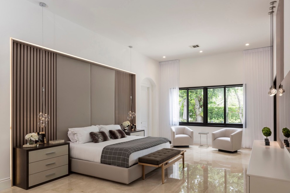 Large contemporary master bedroom in Miami with white walls, marble floors, no fireplace and beige floor.
