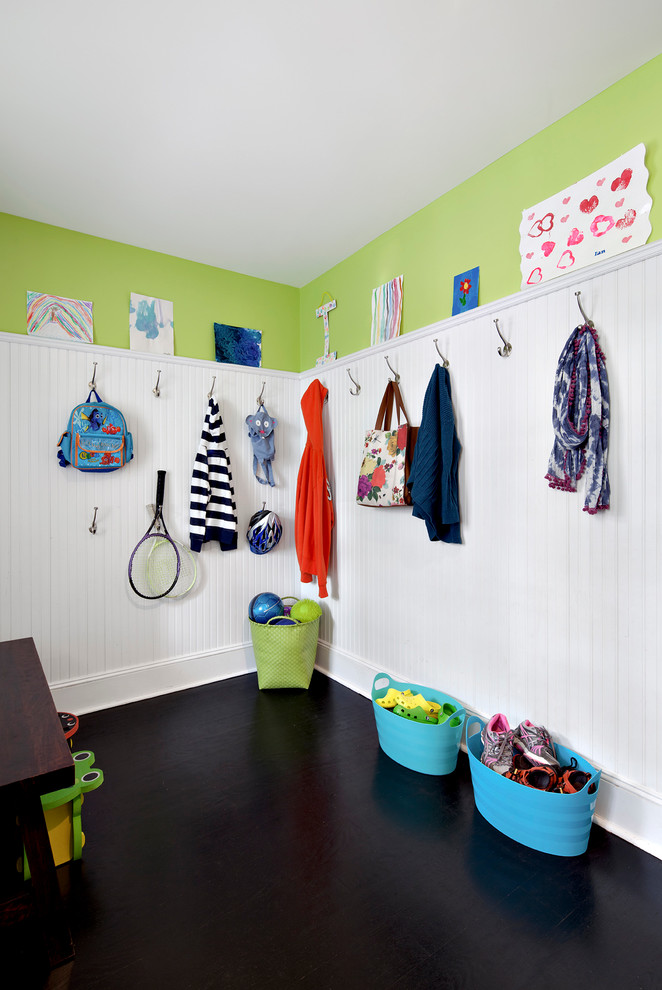 Photo of a transitional mudroom in New York with green walls.