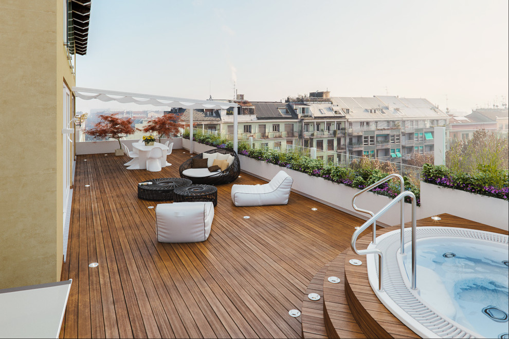 Design ideas for an expansive contemporary rooftop deck in Milan with a container garden and an awning.