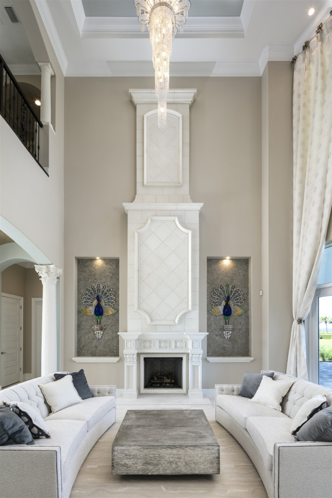 Expansive contemporary formal open concept living room in Orlando with beige walls, marble floors, a standard fireplace, a concrete fireplace surround, beige floor and recessed.