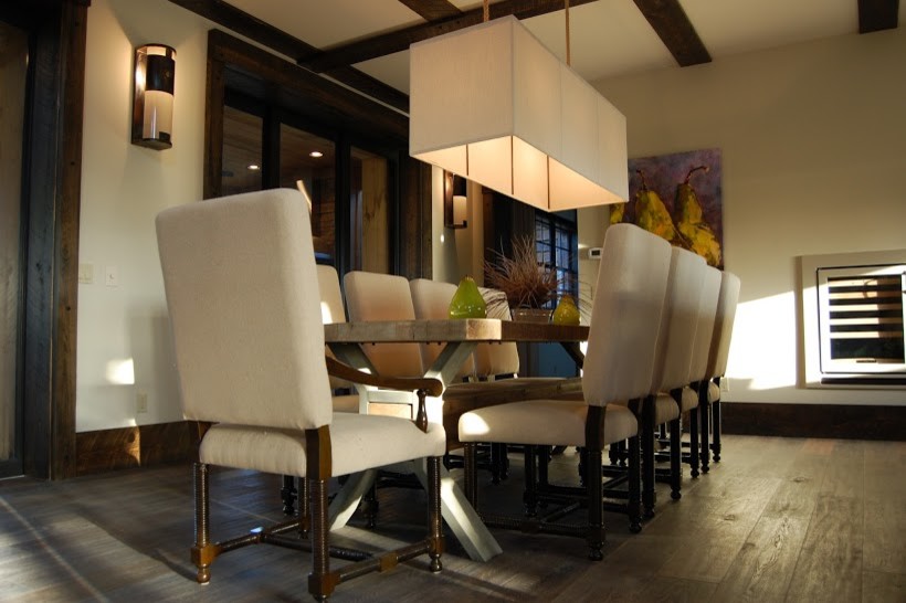 Huge mountain style dark wood floor kitchen/dining room combo photo in Miami with white walls