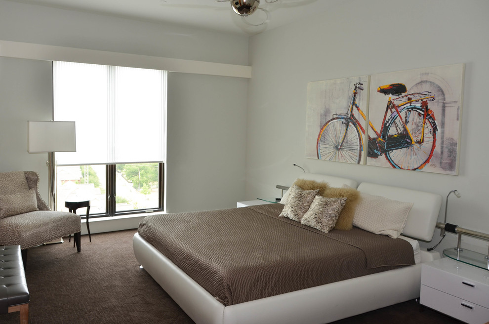 This is an example of a mid-sized contemporary guest bedroom in Dallas with grey walls, carpet and no fireplace.