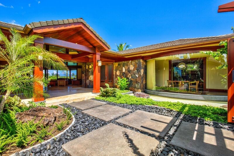 Inspiration for a large arts and crafts one-storey stucco beige exterior in Hawaii with a hip roof.