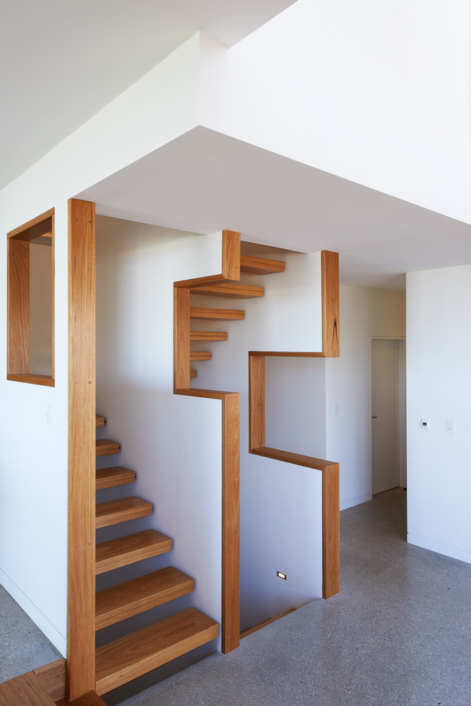 Mid-sized contemporary wood floating staircase in Sydney with open risers.